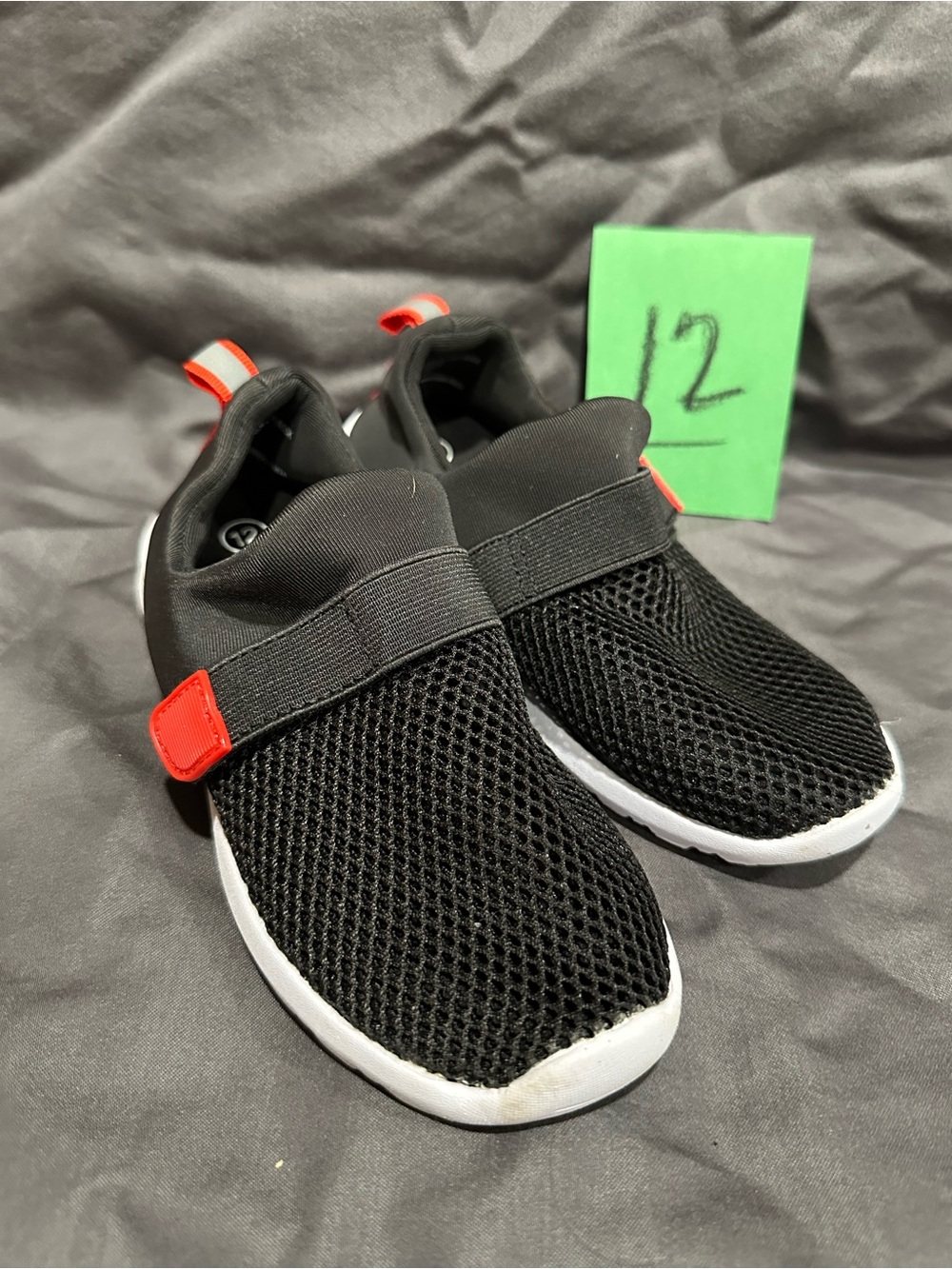 Kids Black Slip-On Mesh Sneakers with Red Accents